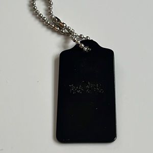 Coach black metal Hangtag